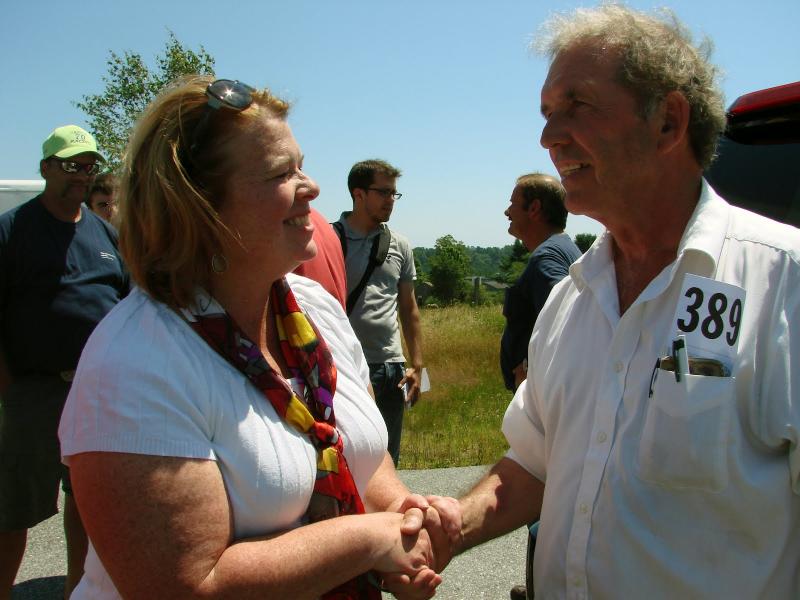 Richard Jordan shakes hands with Wiscasset Town Manager Laurie Smith after Jordan bought the Wiscasset Raceway July 12. SUSAN JOHNS/Wiscasset Newspaper
